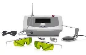 Medical laser device with two handheld probes and two pairs of green protective safety glasses.